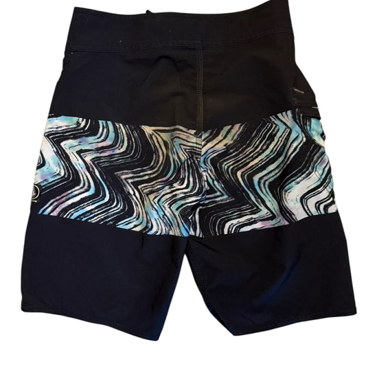 Black shorts with a colorful zigzag pattern on a white background