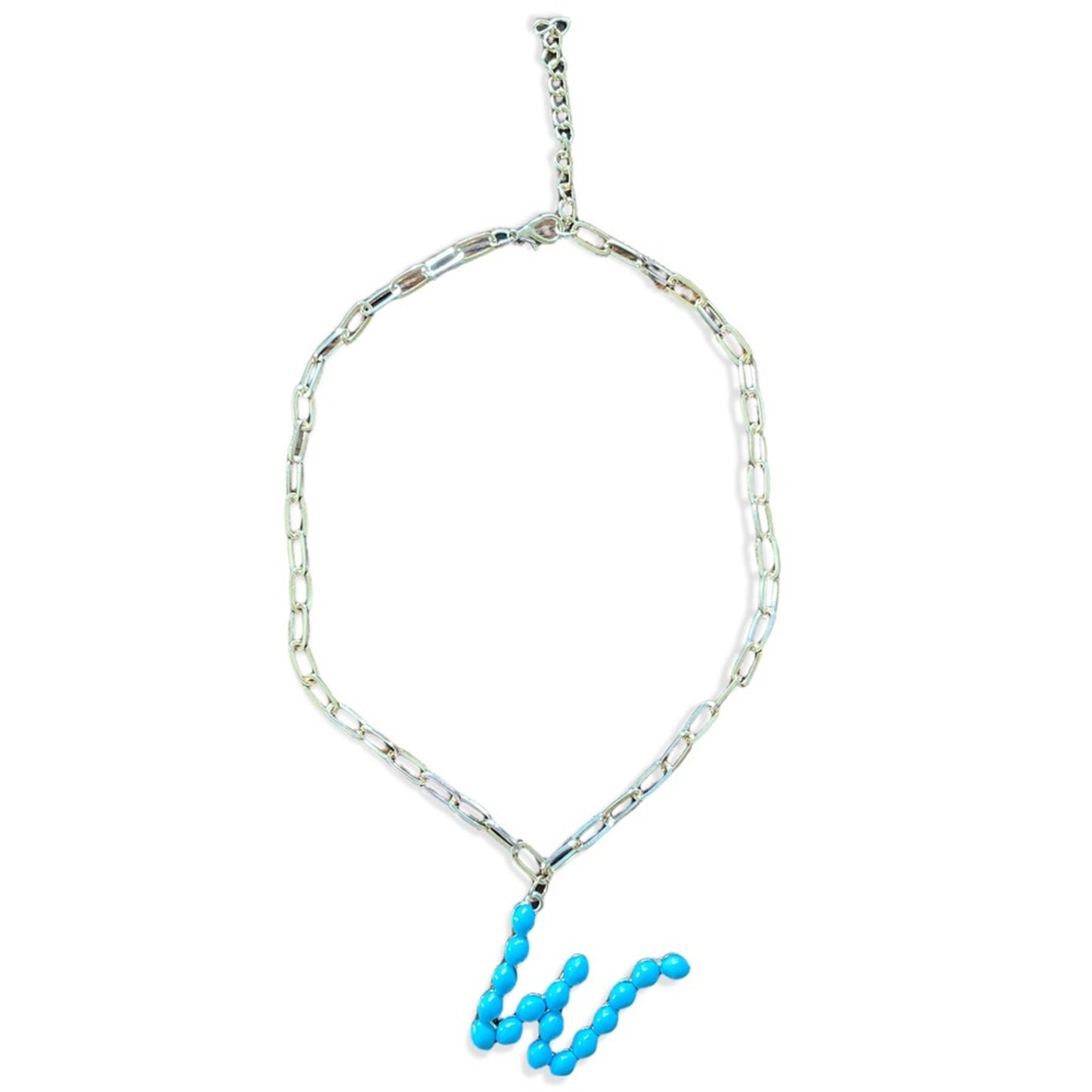 A gold-toned chain necklace featuring a wavy, segmented turquoise blue bead pendant, displayed against a solid white background.