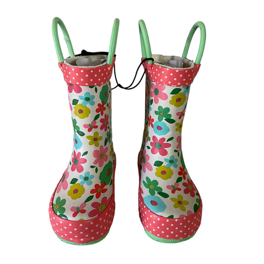 Pair of colorful floral-patterned rain boots with pink polka dot trim on a white background