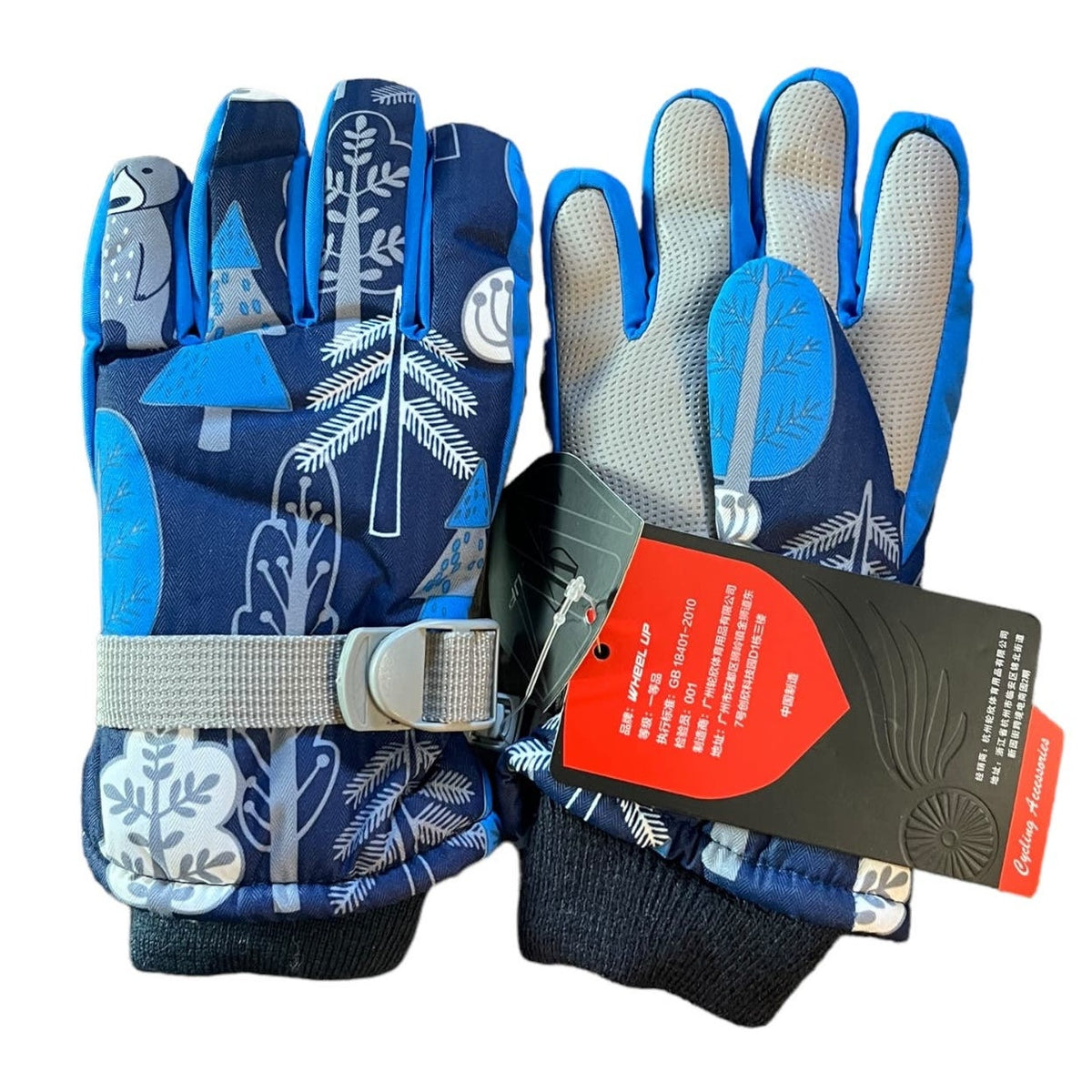 A pair of blue and navy winter gloves with a forest pattern, featuring a gray wrist strap and a black and red product tag, shown on a white background.