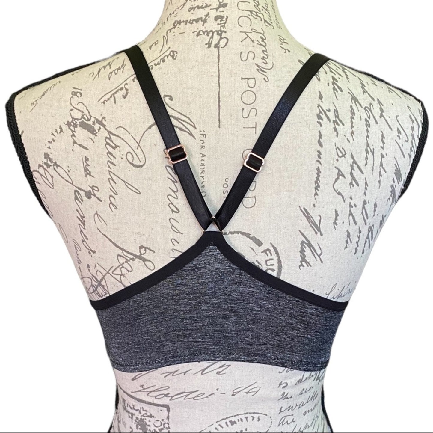 Back view of a women's bra displayed on a fabric mannequin torso.