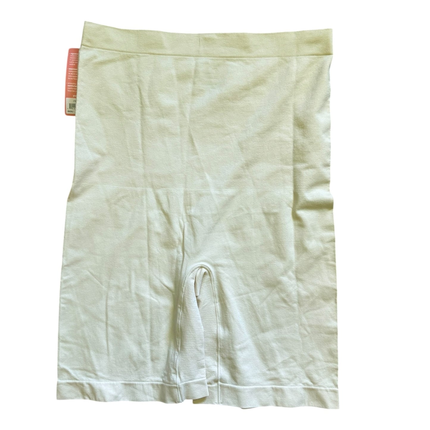 Beige shapewear shorts with a visible brand tag on a white background