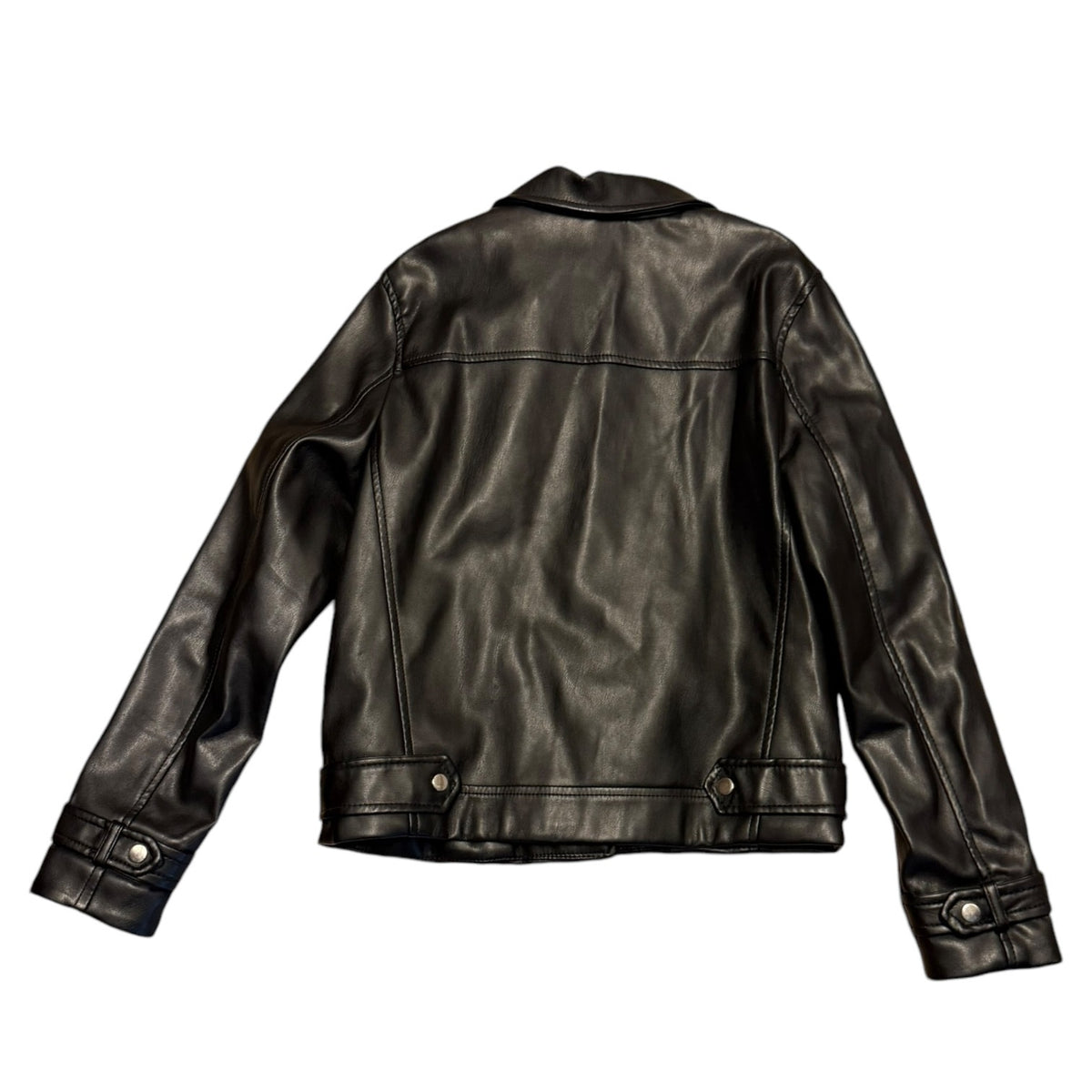 A black faux leather jacket shown from the back, featuring a classic collar, long sleeves with buttoned cuffs against a solid white background.