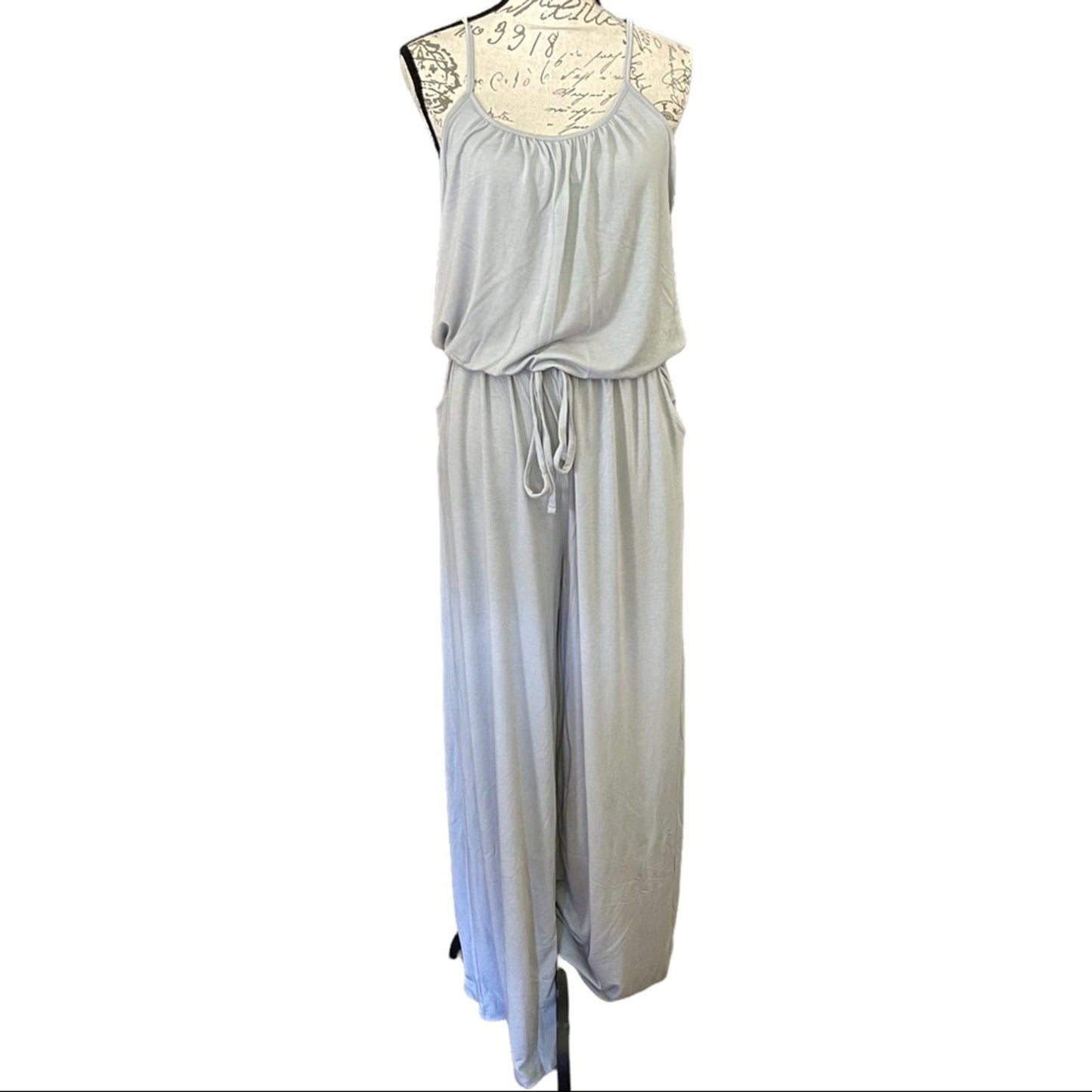 Front of Light gray jumpsuit on a mannequin with a white background