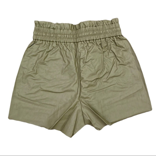 Back of high waisted green shorts on a white background