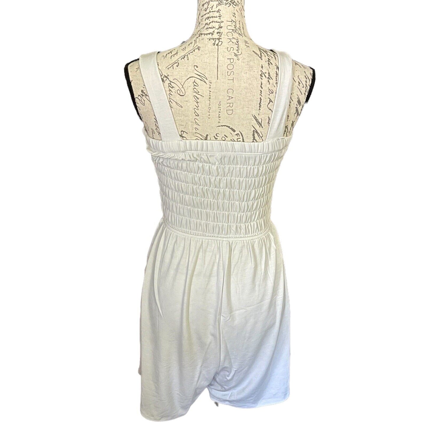 Back of off White romper on a mannequin with a white background
