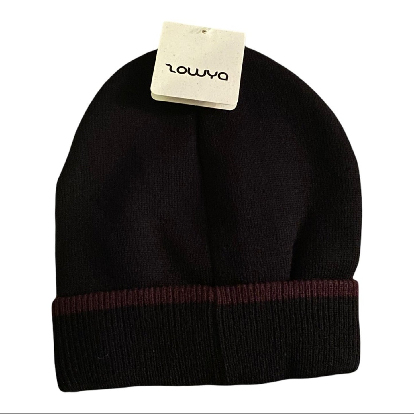 Black beanie with a tag at the top on a white background