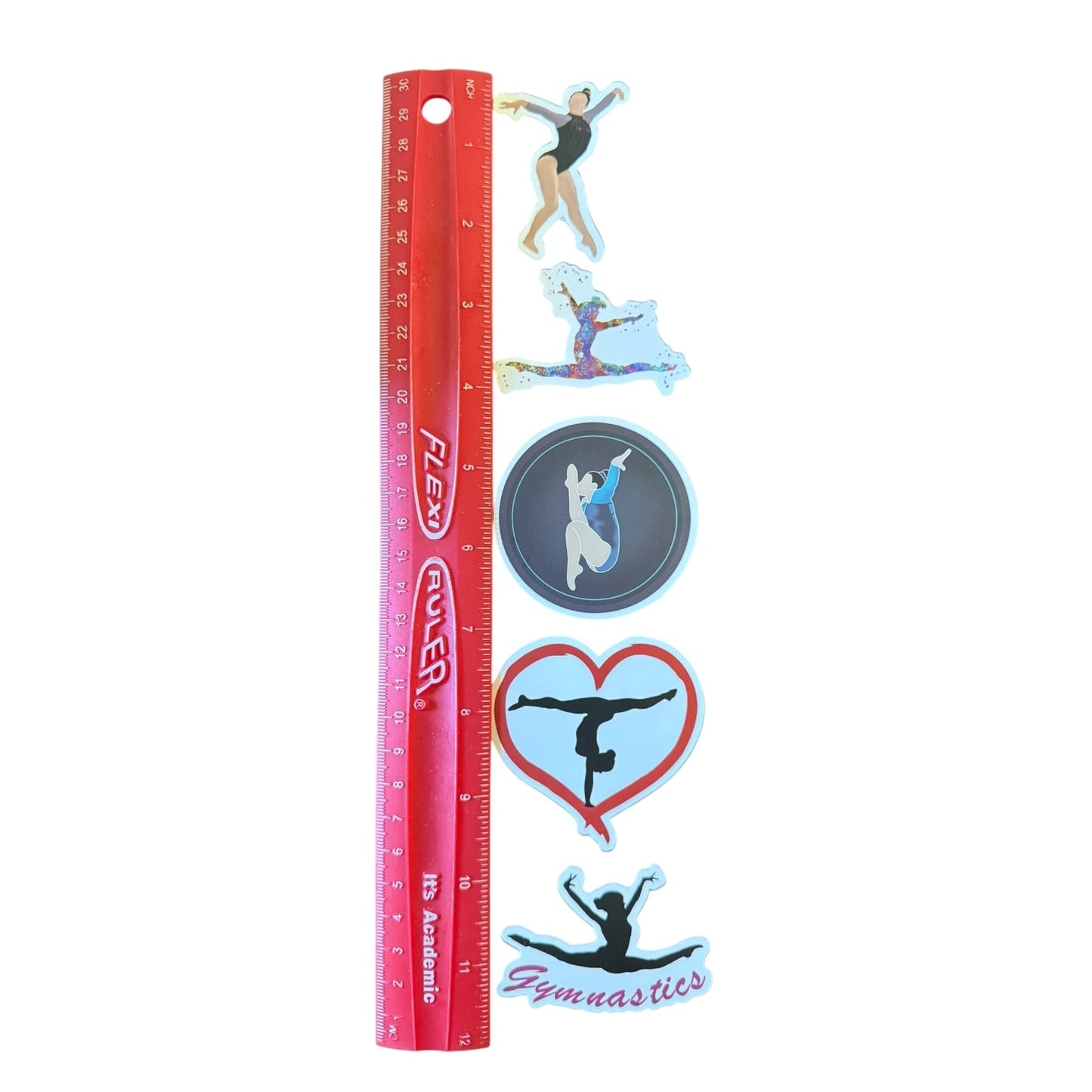 Red ruler with gymnastics-themed stickers on a white background
