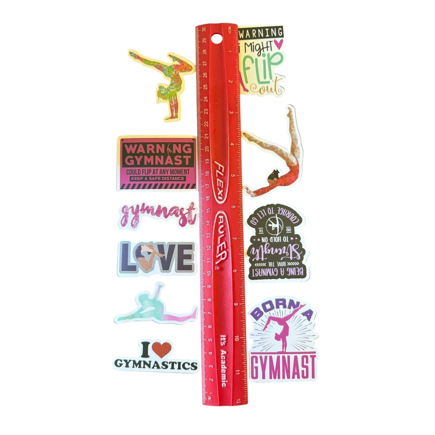 Red ruler with gymnastics-themed stickers on a white background