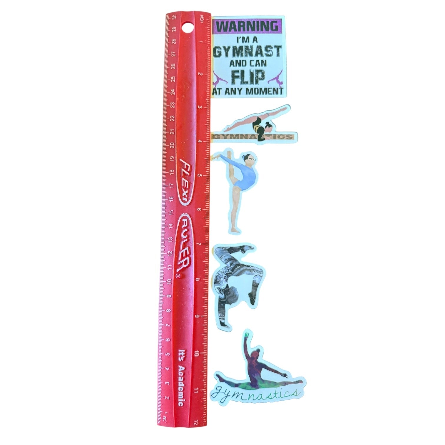 Ruler with gymnastics-themed stickers on a white background