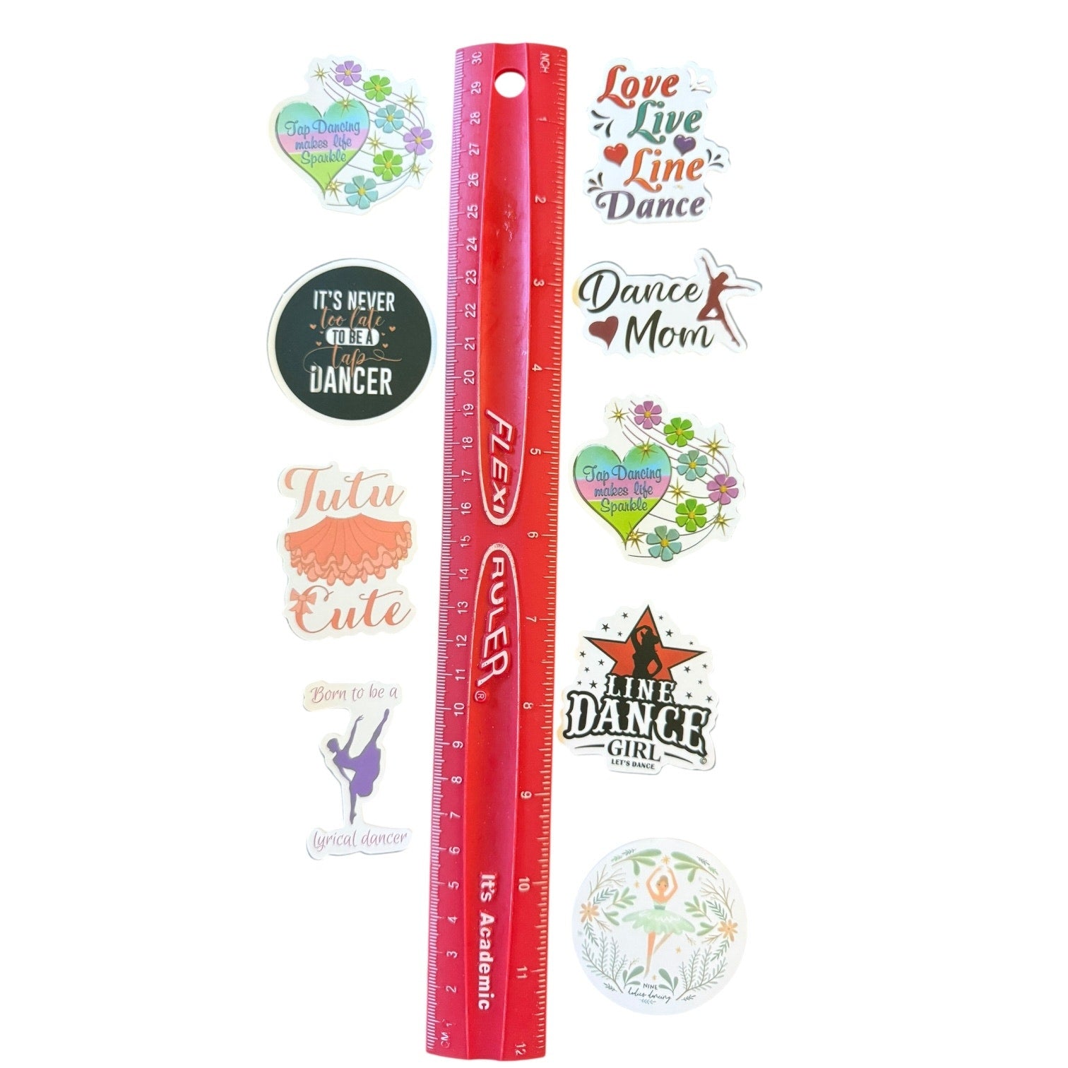 Red ruler with various dance-themed stickers on a white background