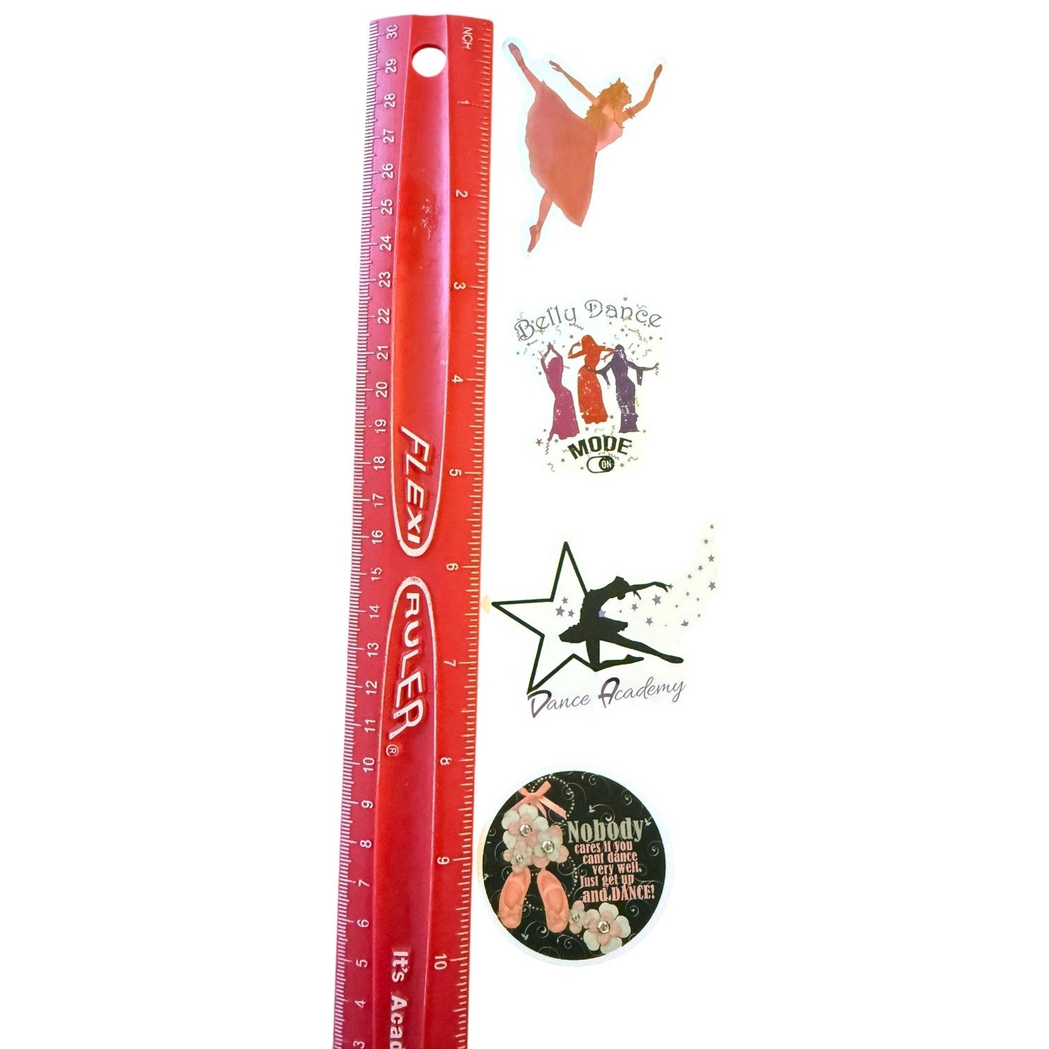 Red ruler with various dance-themed stickers on a white background