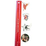 Red ruler with various dance-themed stickers on a white background
