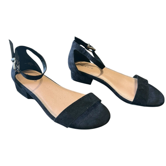 Pair of black faux suede shoes on a white background