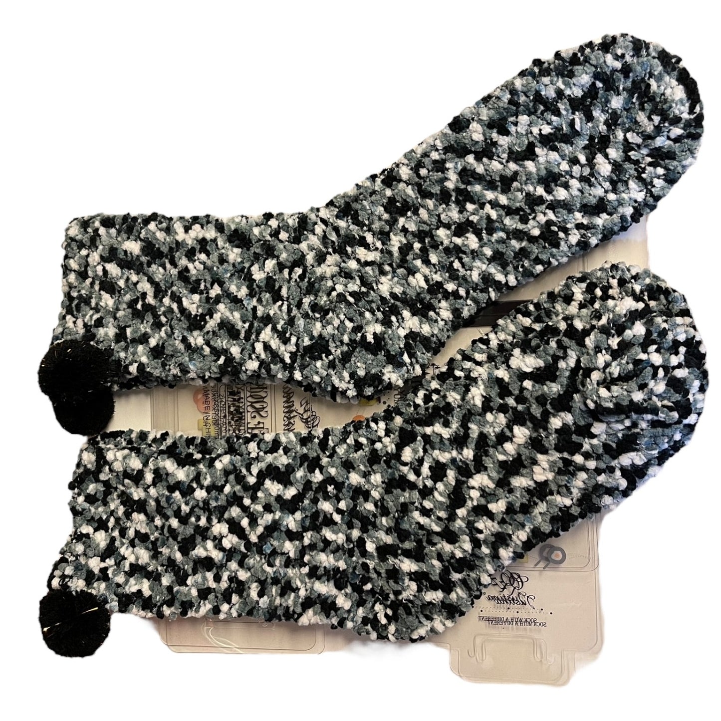 Pair of black and white patterned socks on a white background