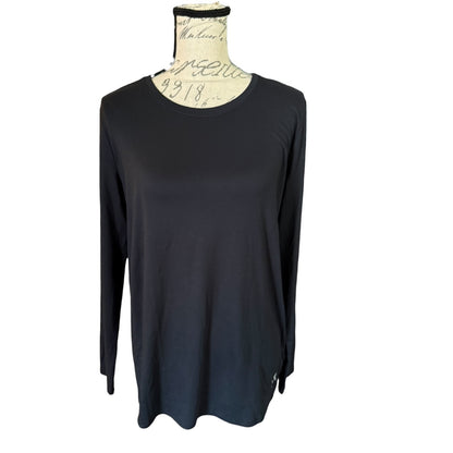 A black long-sleeve top displayed on a cream-colored dress form mannequin against a plain white background.