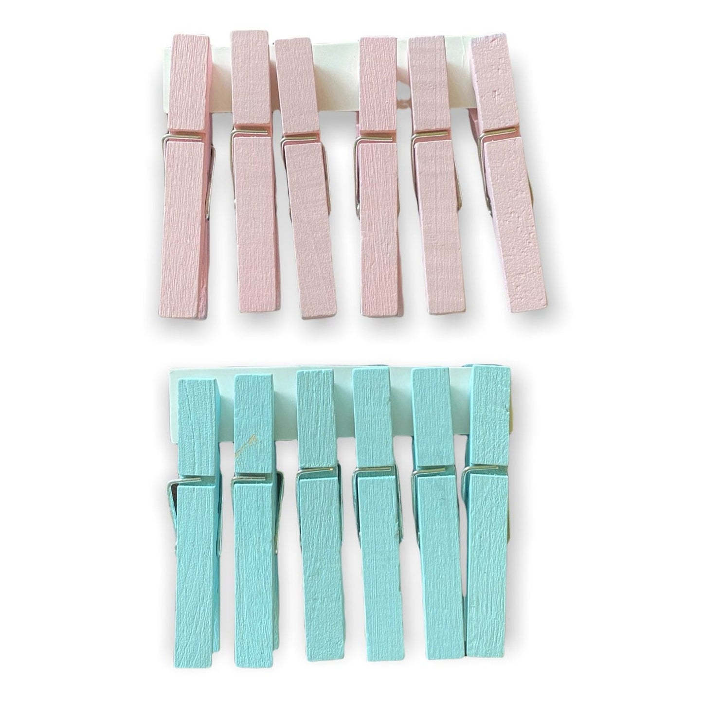 Set of pink and blue clothespins on a white background