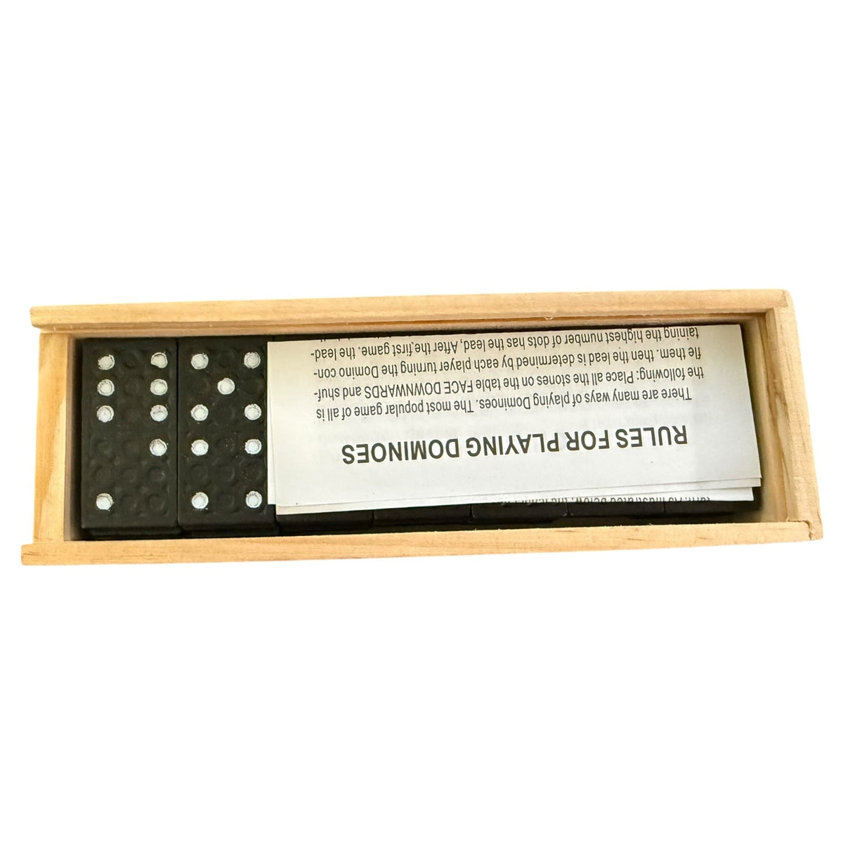 Domino set with wooden box and rules sheet on a white background