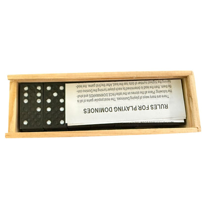 Domino set with wooden box and rules sheet on a white background