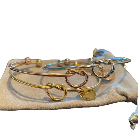 Set of 3 bracelet on a beige fabric background