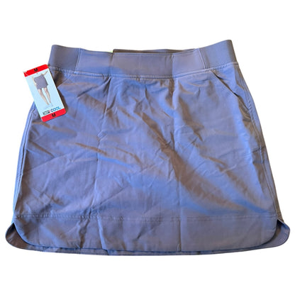 Purple skort with a tag on a white background