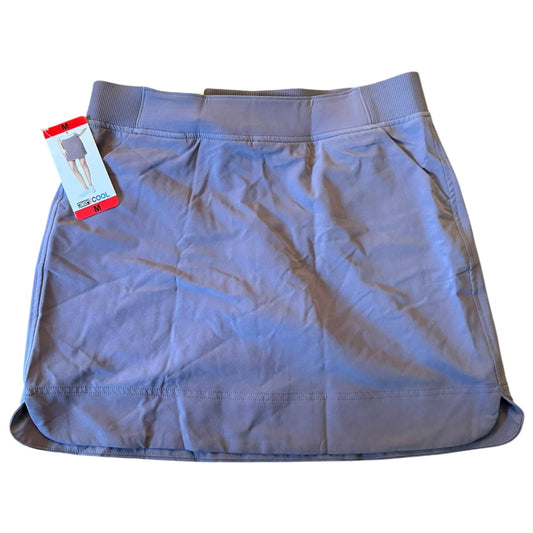 Purple skort with a tag on a white background