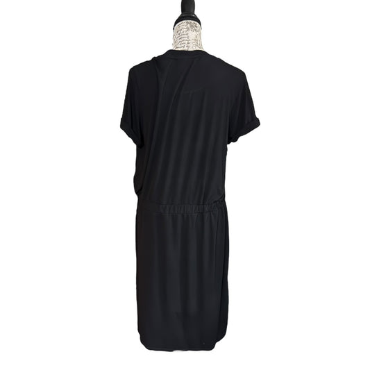 Black dress on a mannequin against a white background