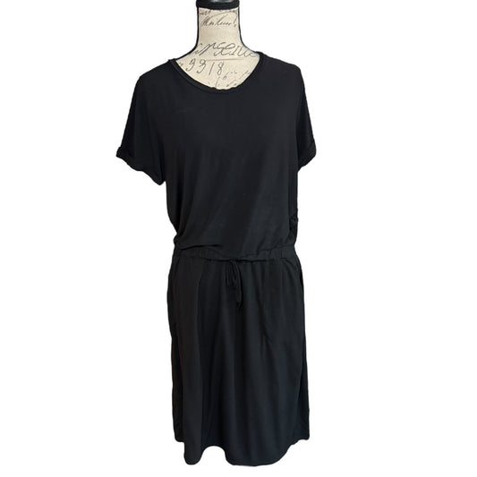 Black dress on a mannequin against a white background