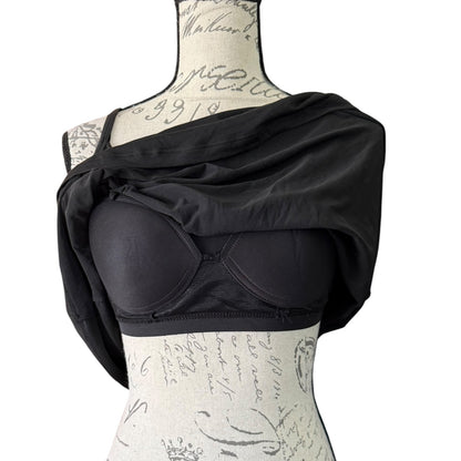 Black tank top with showing built in bra on a mannequin against a white background