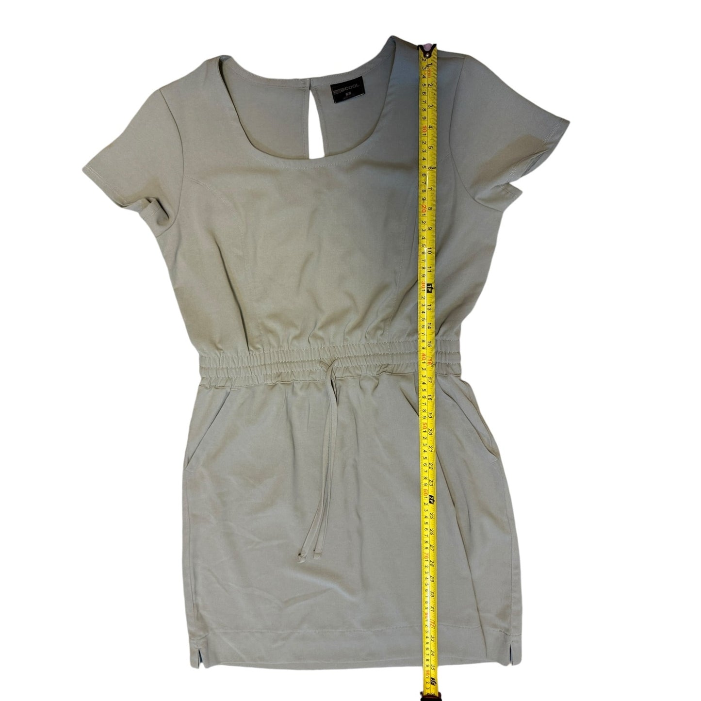 Gray dress with a measuring tape on a white background