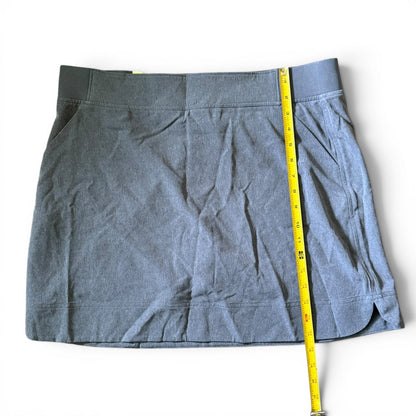 Blue skort with a measuring tape on a white background
