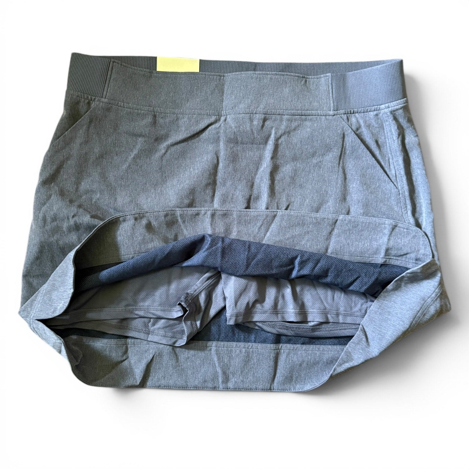 Blue skort showing shorts on a white background