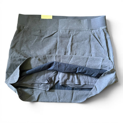 Blue skort showing shorts on a white background