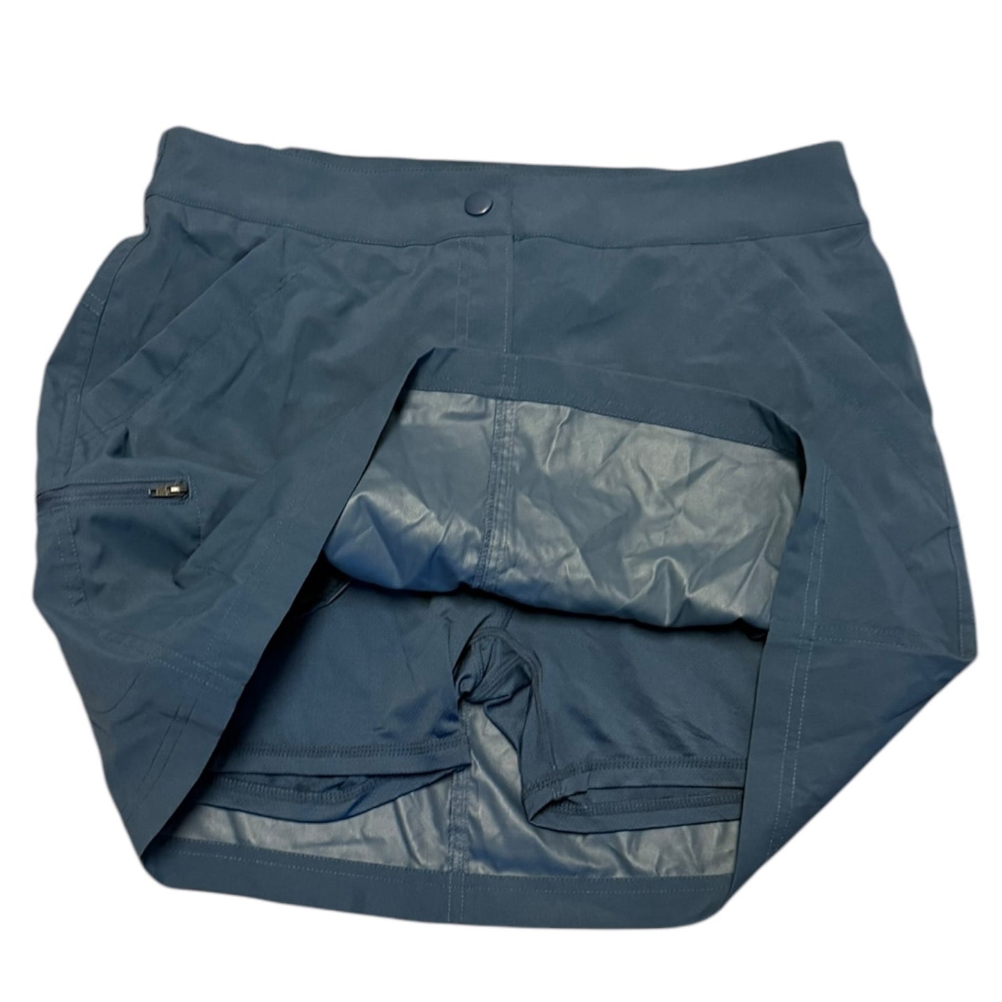 Blue skorts with a pocket on a white background