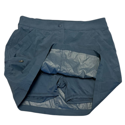 Blue skorts with a pocket on a white background