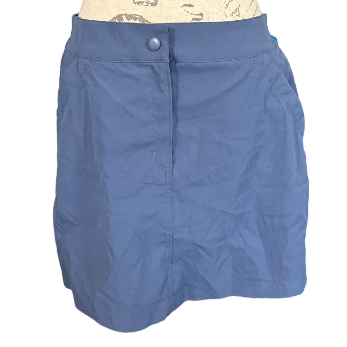 Front of skirt on a mannequin with a white background