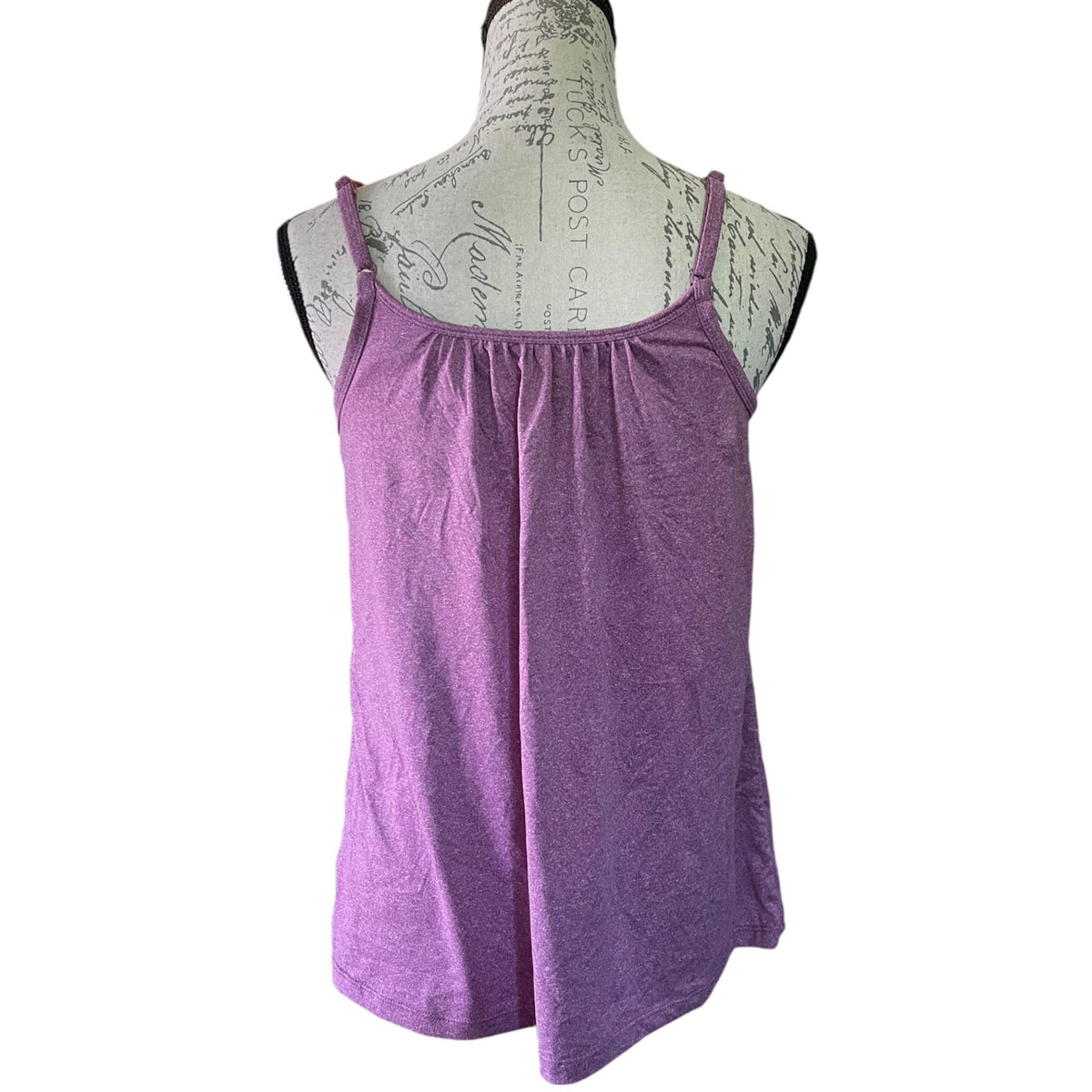 Purple tank top on a mannequin with a white background