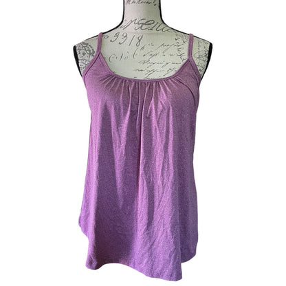 Purple tank top on a mannequin with lace details against a white background