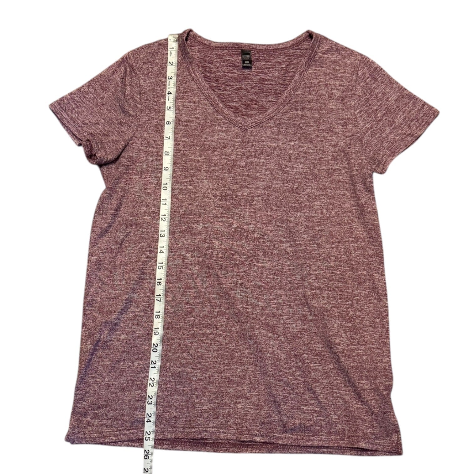 Red t-shirt with a measuring tape on a white background