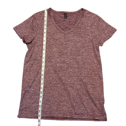 Red t-shirt with a measuring tape on a white background