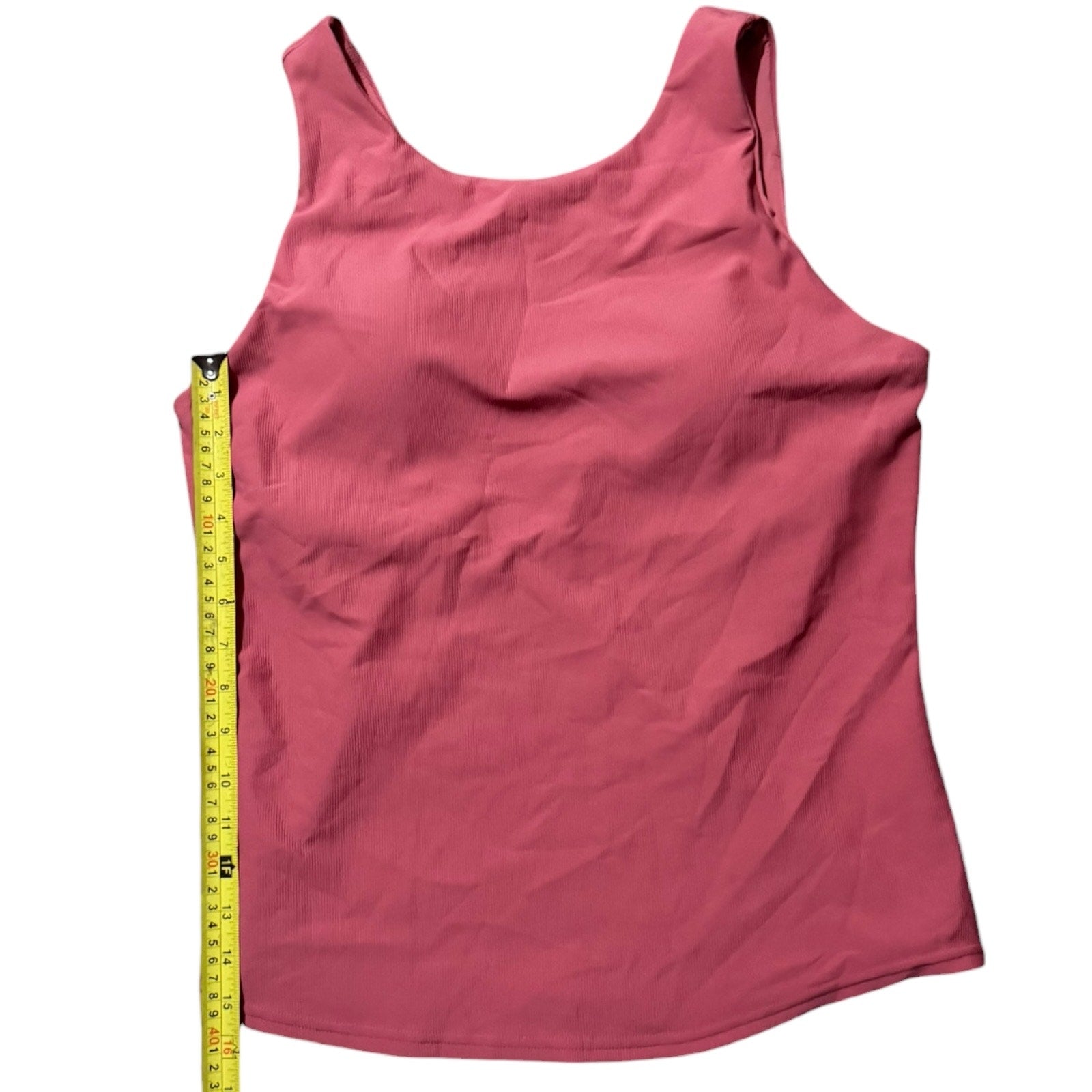 tank top with a measuring tape on a white background