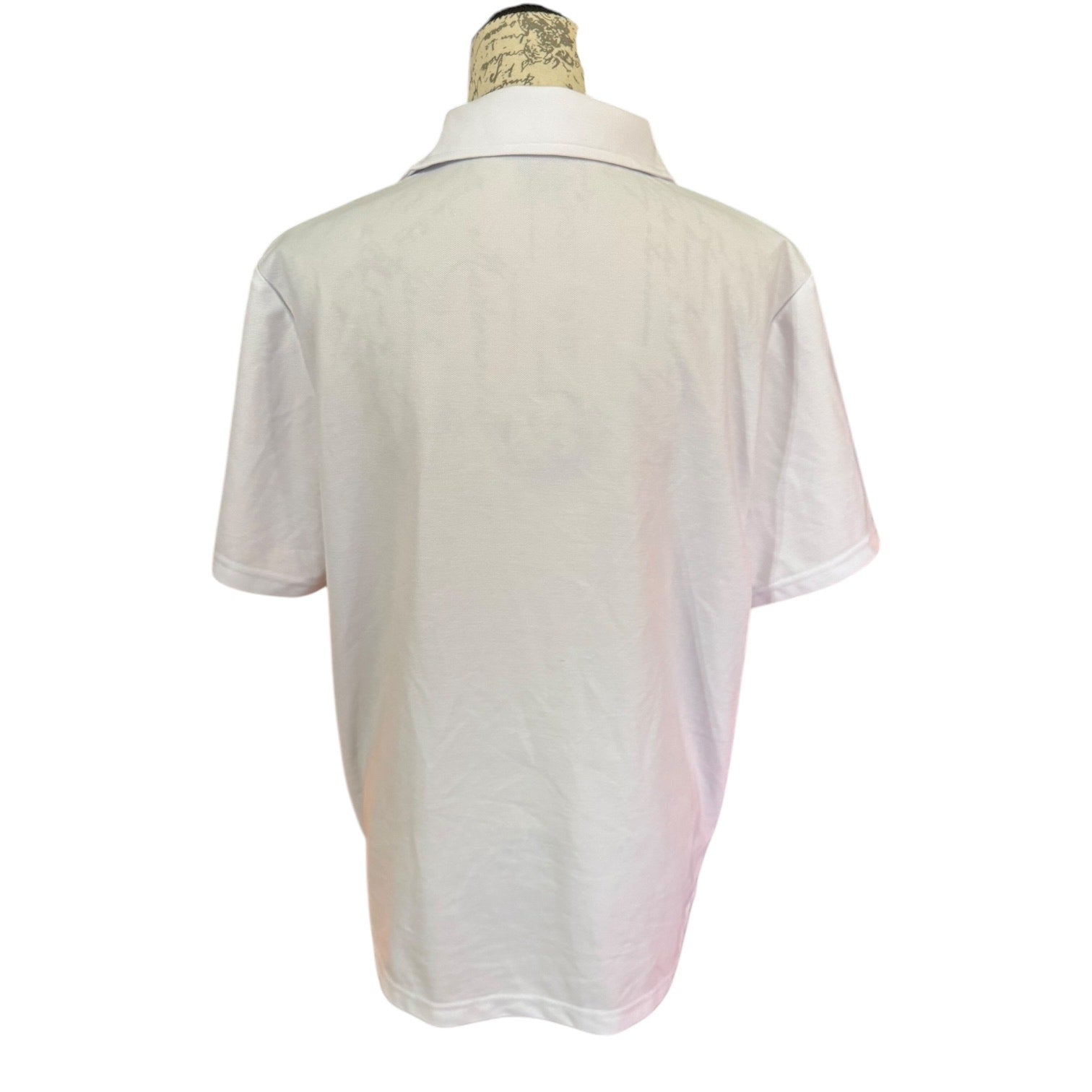 Back of White polo shirt on a mannequin against a white background