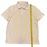 polo shirt with a measuring tape displayed on a white background