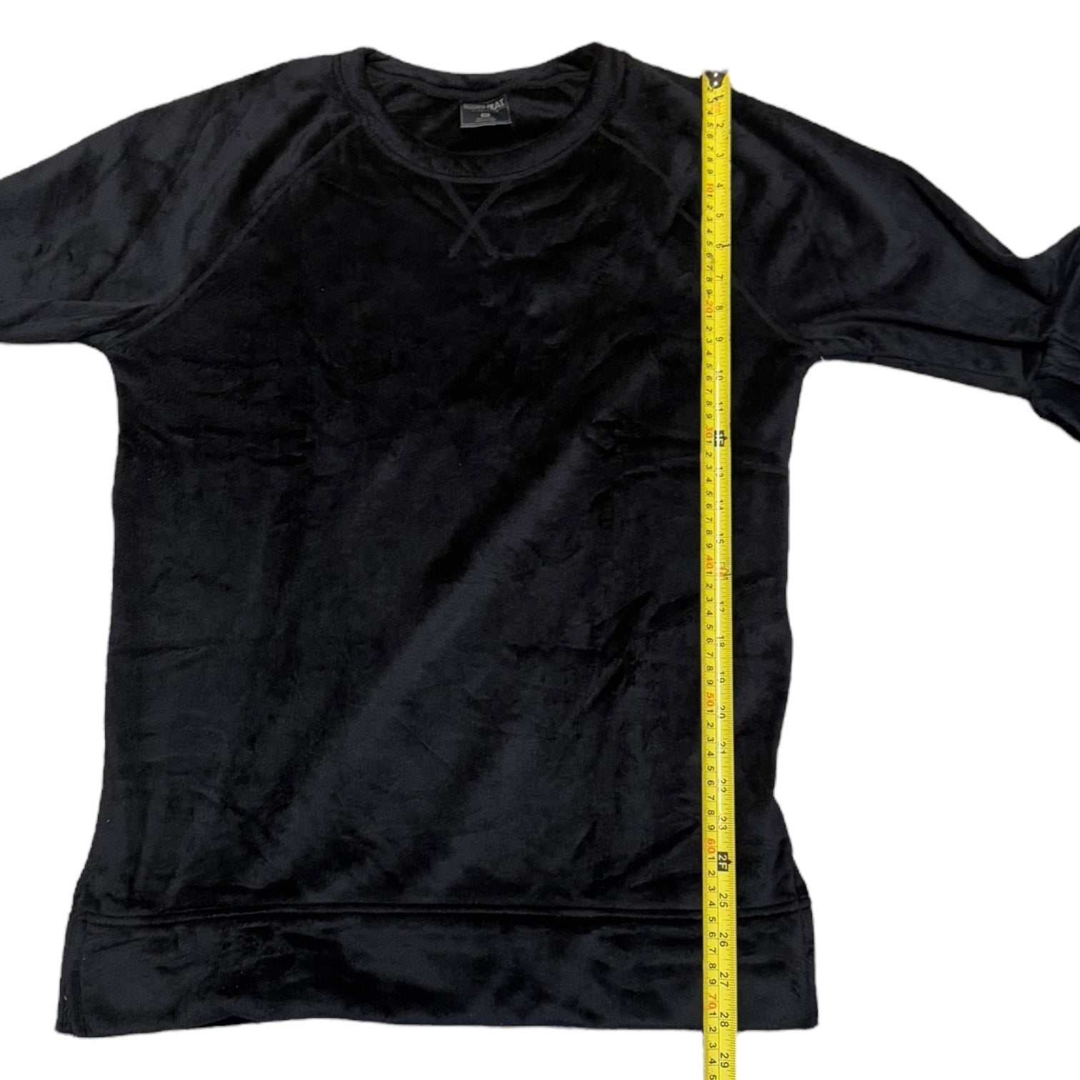 Gray long-sleeve shirt with a yellow measuring tape on a white background
