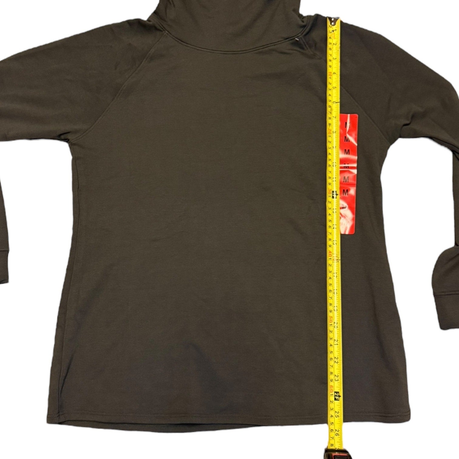 Green pullover with a measuring tape displayed on a white background