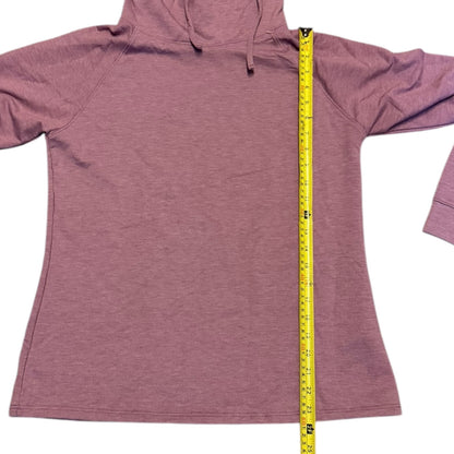 Pink sweater with a measuring tape displayed on a white background