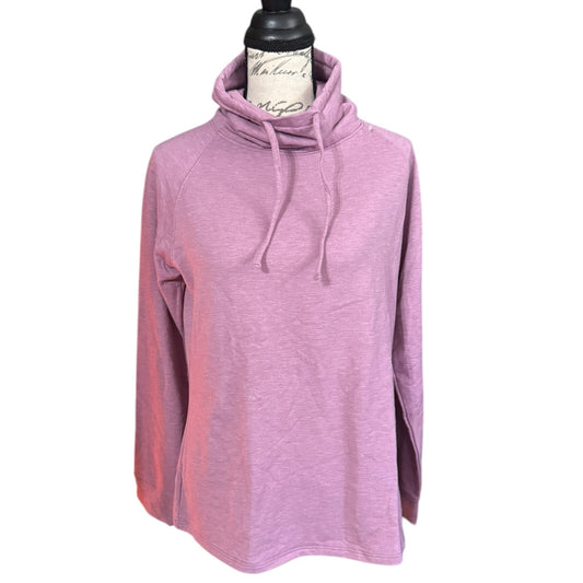 Pink sweater on a mannequin against a white background