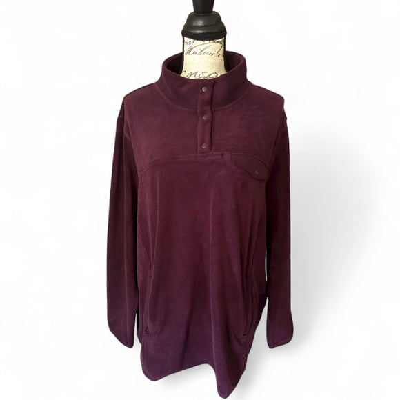 Purple pullover on a mannequin against a white background