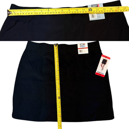 Black skort with a measuring tape and tags on a white background