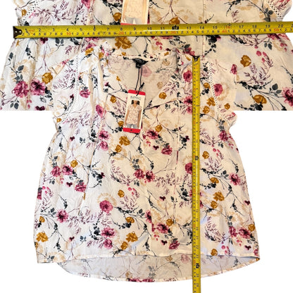 Floral shirt with a measuring tape displayed on a white background